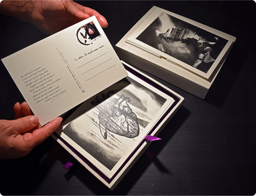 Photo showcasing the poems and illustrations in their distinct postcards along with the personalized keepsake box.